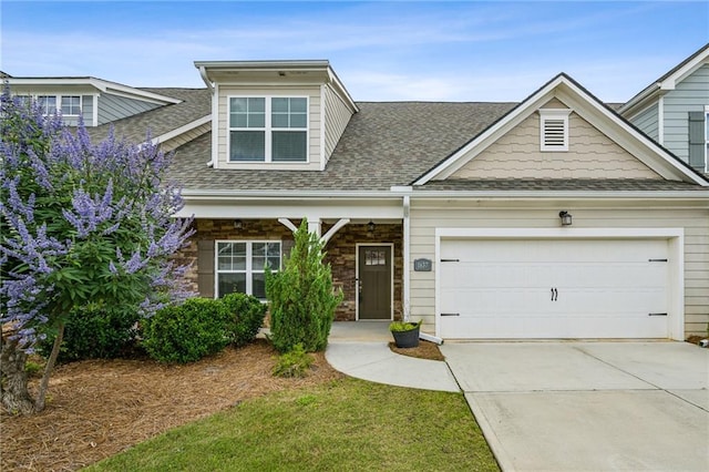 1637 Short Shadow Ln, Snellville, GA 30078 - craftsman-style home featuring a shingled roof, a garage, concrete driveway, and stone siding