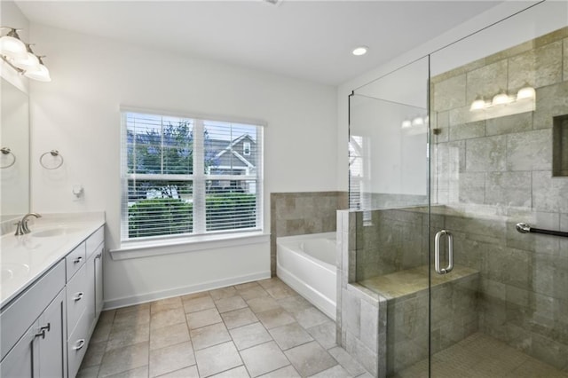 1637 Short Shadow Ln, Snellville, GA 30078 - full bathroom with double vanity, a bath, a shower stall, and recessed lighting