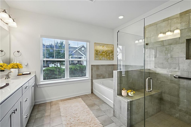 1637 Short Shadow Ln, Snellville, GA 30078 - bathroom with vanity, a bath, a stall shower, tile patterned flooring, and recessed lighting