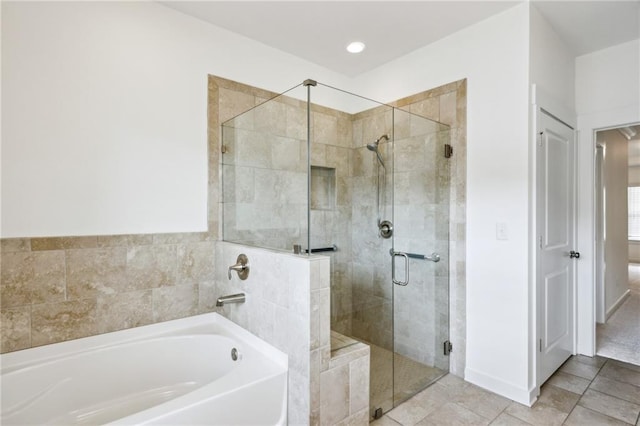 1637 Short Shadow Ln, Snellville, GA 30078 - full bath featuring a garden tub and a stall shower