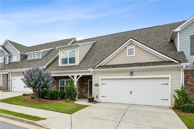 1637 Short Shadow Ln, Snellville, GA 30078 - view of front facade with concrete driveway, roof with shingles, and an attached garage