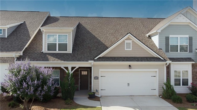 1637 Short Shadow Ln, Snellville, GA 30078 - view of front facade with an attached garage, driveway, and roof with shingles