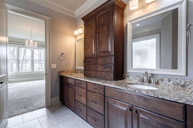 bathroom featuring vanity, crown molding, tile patterned floors, and a chandelier