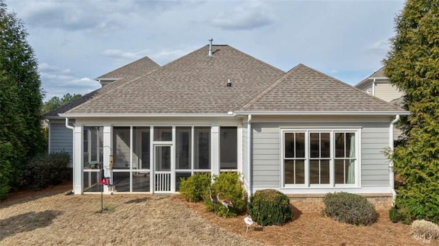 back of house featuring a sunroom