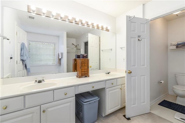 11885 Carriage Park Ln, Duluth, GA 30097 - bathroom featuring double vanity, a shower, and tile patterned floors