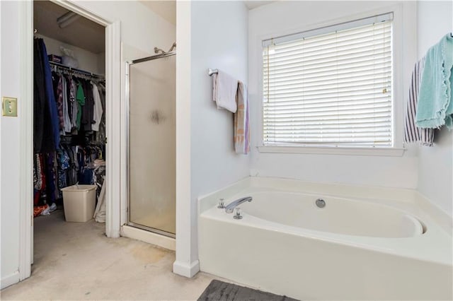 11885 Carriage Park Ln, Duluth, GA 30097 - full bathroom featuring a bath, a stall shower, and a spacious closet