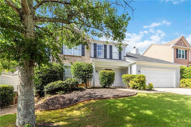 11885 Carriage Park Ln, Duluth, GA 30097 - traditional home featuring a front lawn, driveway, an attached garage, and a chimney
