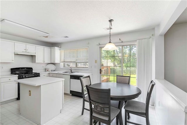 11885 Carriage Park Ln, Duluth, GA 30097 - kitchen with dishwasher, gas range, light countertops, white cabinetry, and a textured ceiling