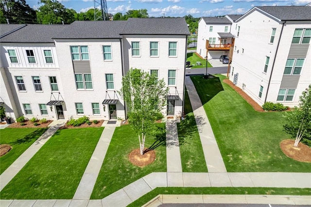 view of property featuring a front yard