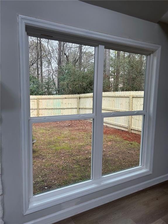 interior details featuring baseboards and wood finished floors