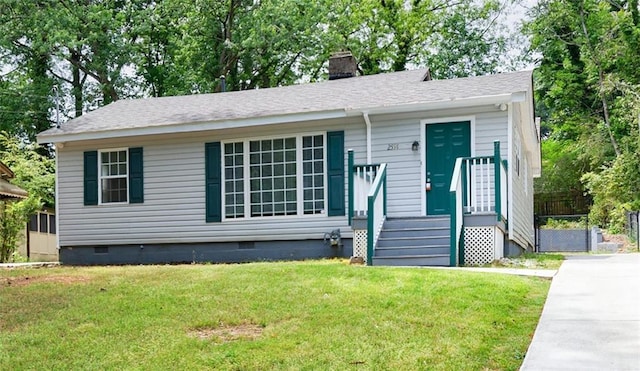 view of front facade featuring a chimney, a shingled roof, a front lawn, and crawl space