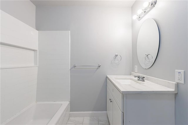 full bathroom featuring shower / bath combination, vanity, marble finish floor, and baseboards