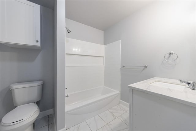 bathroom featuring washtub / shower combination, vanity, toilet, marble finish floor, and baseboards