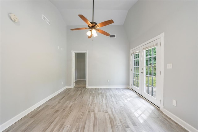 empty room with a ceiling fan, visible vents, high vaulted ceiling, and light wood-style floors