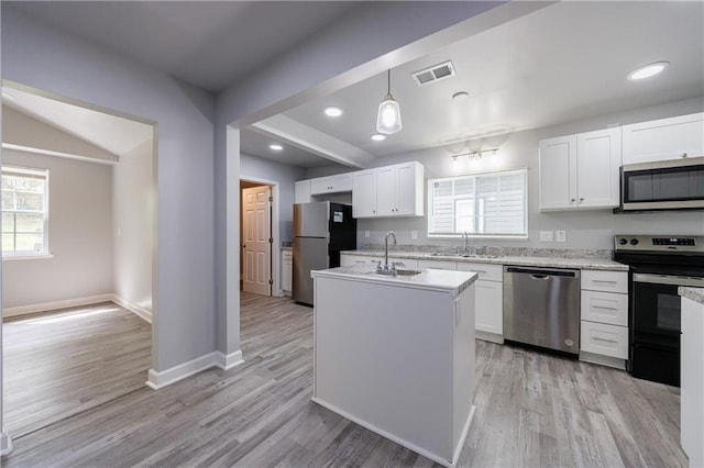 kitchen featuring a sink, visible vents, white cabinets, and appliances with stainless steel finishes