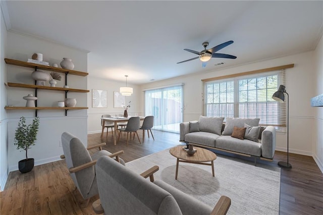 living room with dark wood-style floors, visible vents, and baseboards