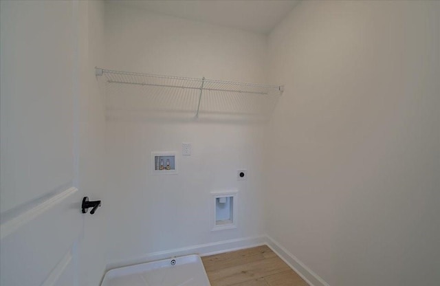 laundry room featuring electric dryer hookup, hookup for a washing machine, and wood-type flooring