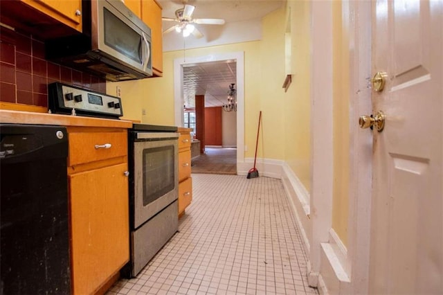 kitchen featuring ceiling fan, stainless steel appliances, light tile patterned floors, and backsplash