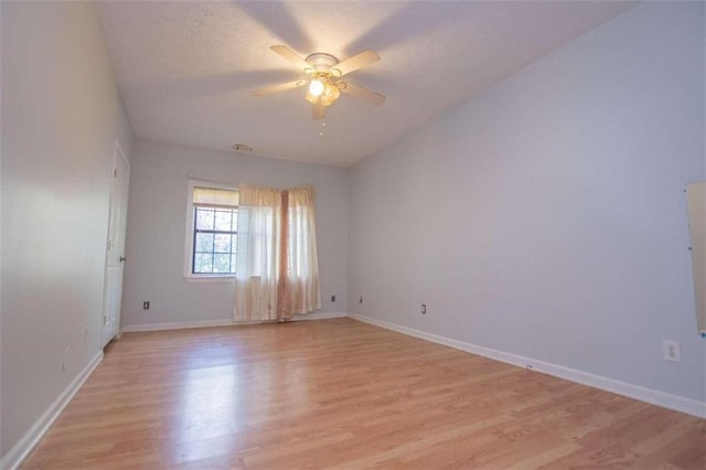 empty room featuring light hardwood / wood-style floors and ceiling fan