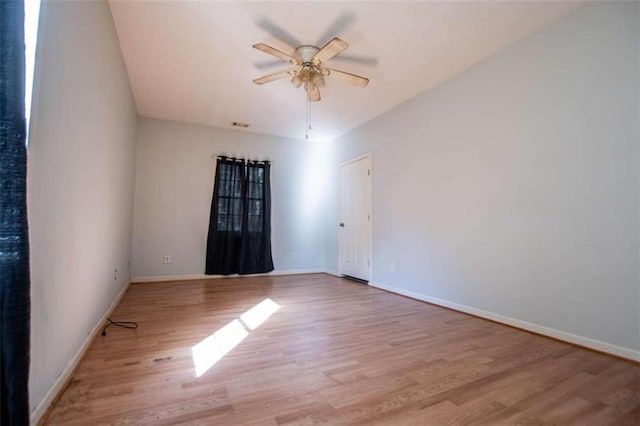 empty room with light hardwood / wood-style floors and ceiling fan