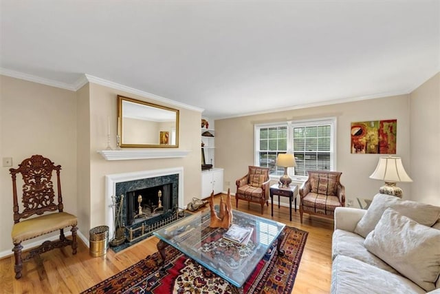 30 Chaumont Sq NW, Atlanta, GA 30327 - living room featuring light wood-type flooring, a fireplace, and crown molding