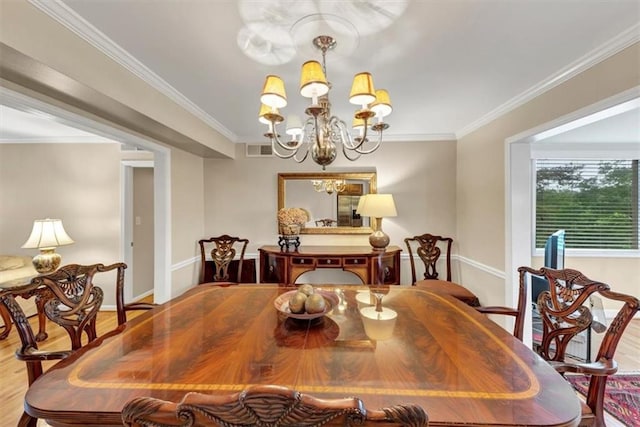 30 Chaumont Sq NW, Atlanta, GA 30327 - dining space featuring wood finished floors, a chandelier, and crown molding