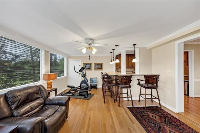 30 Chaumont Sq NW, Atlanta, GA 30327 - living area featuring crown molding, light wood finished floors, and a ceiling fan