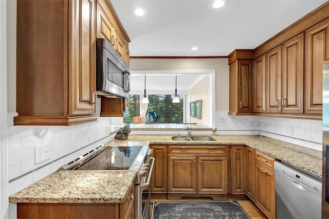 30 Chaumont Sq NW, Atlanta, GA 30327 - kitchen featuring appliances with stainless steel finishes, brown cabinets, decorative backsplash, light stone counters, and recessed lighting
