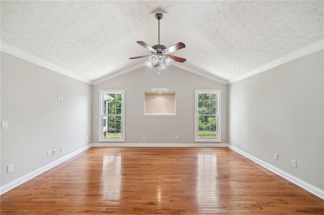 unfurnished living room featuring ceiling fan, plenty of natural light, a textured ceiling, and light hardwood / wood-style flooring