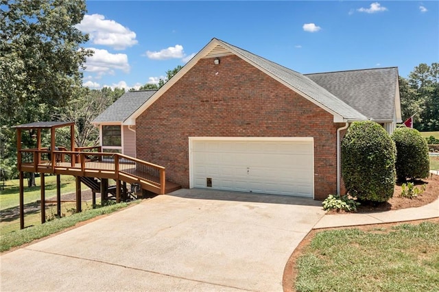 view of side of property featuring a deck and a garage