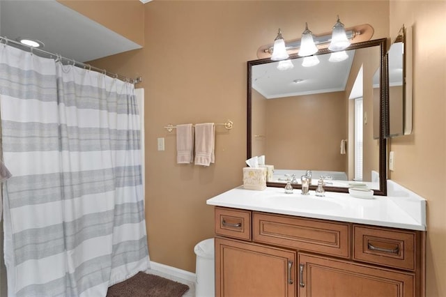 full bathroom featuring vanity, crown molding, curtained shower, and baseboards