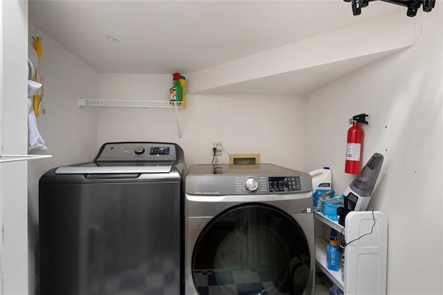 clothes washing area with washer and dryer