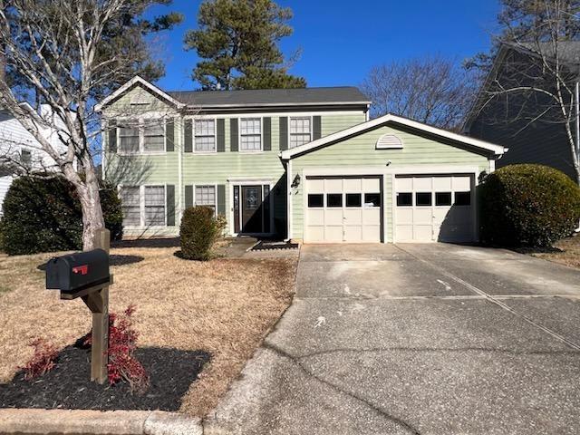 3875 Ivy Run Cir, Duluth, GA 30096 - view of front of property featuring an attached garage and concrete driveway