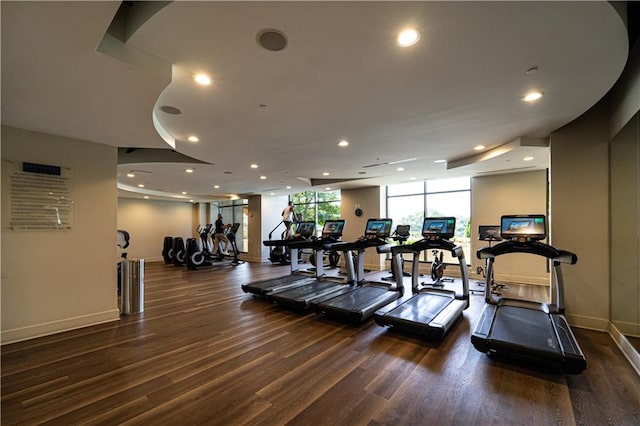 workout area with dark hardwood / wood-style floors