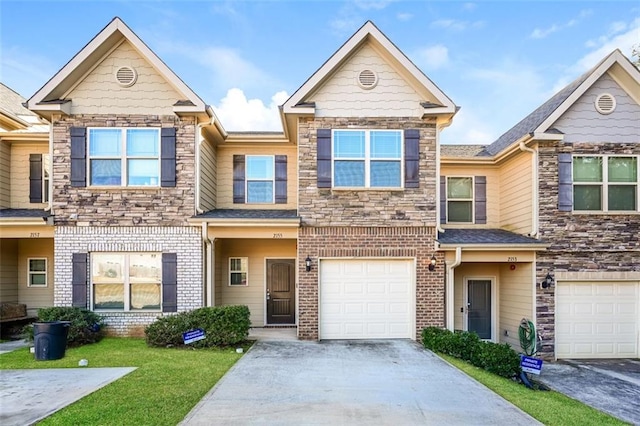 view of property with a garage and a front yard