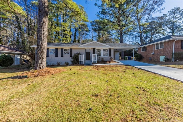 ranch-style house with a front yard and a carport