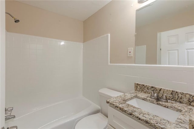 full bathroom with vanity, shower / washtub combination, backsplash, tile walls, and toilet