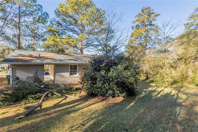 view of home's exterior with a lawn