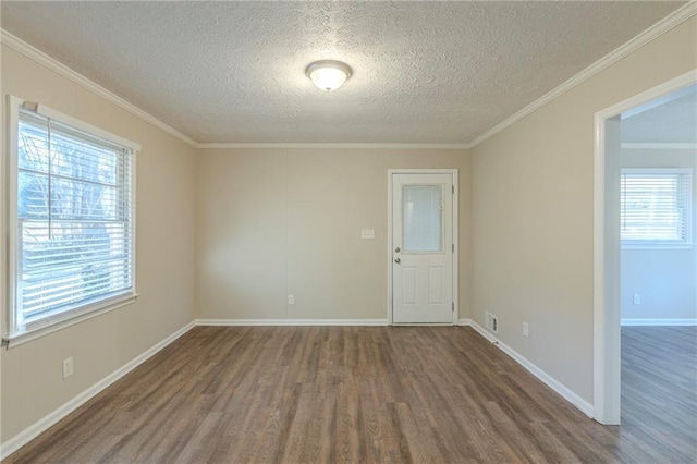 unfurnished room featuring ornamental molding, dark hardwood / wood-style flooring, and a textured ceiling