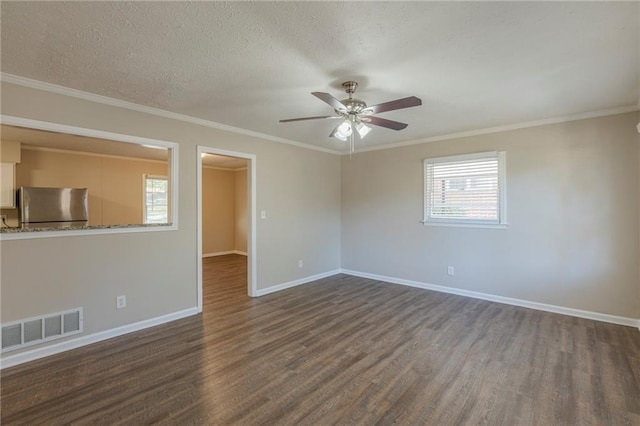 unfurnished room featuring ceiling fan, crown molding, dark hardwood / wood-style flooring, and a textured ceiling