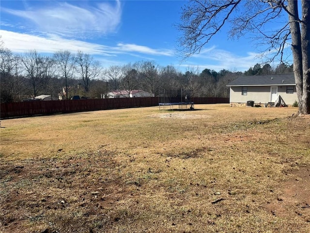 view of yard with a trampoline