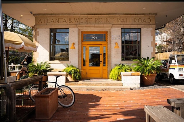 property entrance with brick siding