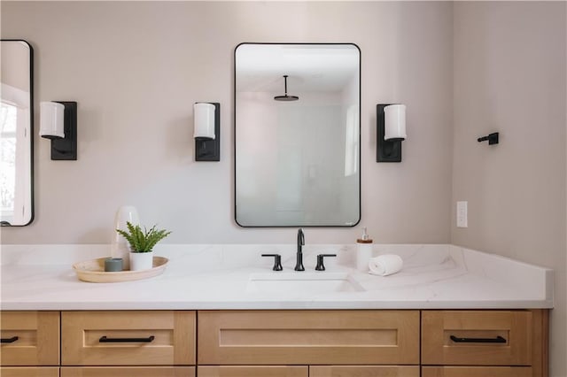 bathroom featuring vanity and walk in shower