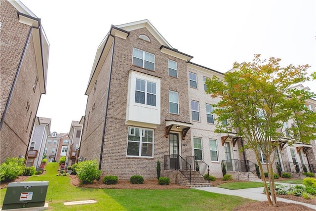 3195 Bartee Walk, Suwanee, GA 30024 - multi unit property featuring brick siding, a front lawn, and a residential view