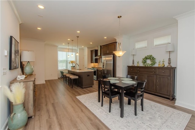 3195 Bartee Walk, Suwanee, GA 30024 - dining area with light wood-style floors, ornamental molding, baseboards, and recessed lighting