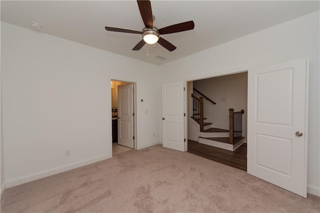 3195 Bartee Walk, Suwanee, GA 30024 - unfurnished bedroom with light colored carpet, baseboards, and ceiling fan