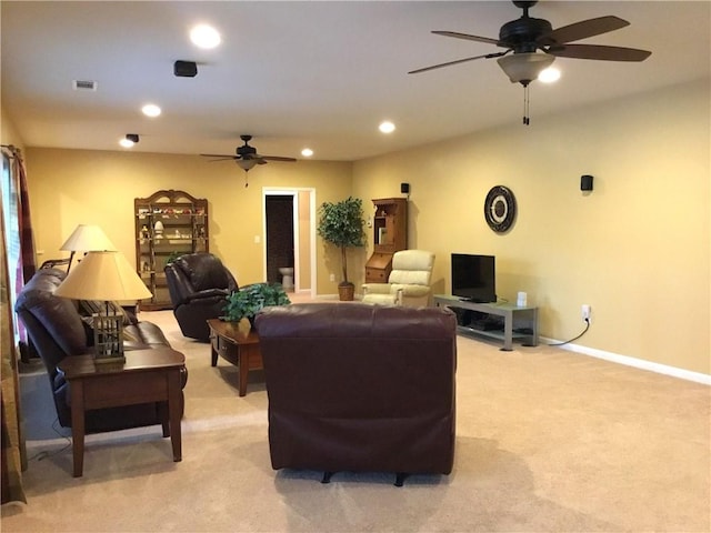 living room featuring recessed lighting, visible vents, baseboards, and light colored carpet