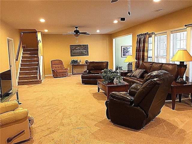 carpeted living room featuring visible vents, stairway, a ceiling fan, and recessed lighting