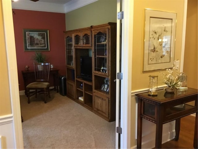 office space with light carpet and crown molding