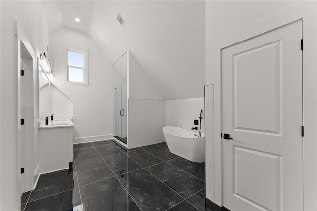 bathroom with independent shower and bath, vaulted ceiling, and vanity